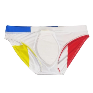 Close-up of men's geometric color-block swim briefs with quick-dry fabric and cup padding