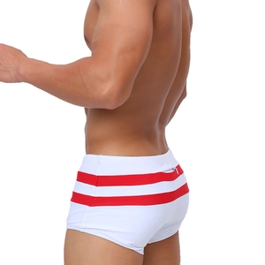 Detailed back view of white swim trunks with red stripes and a functional zipper pocket