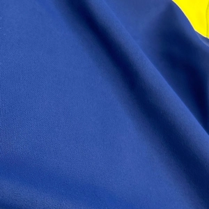 Close-up detail of high-elastic royal blue knit fabric with dense vertical textures