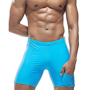 Detail of light blue quick-dry swim trunks featuring a side pocket and elastic fabric