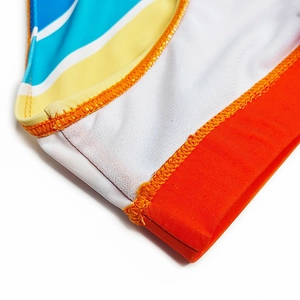 Detailed macro view showing the colorful striped pattern and high-quality stitching on swimwear