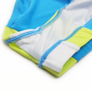 Macro shot showing high-quality stitching and contrast fabric seams on men swimwear