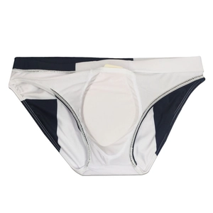 Detailed view of men's color-block swim briefs showing the internal protective cup pad
