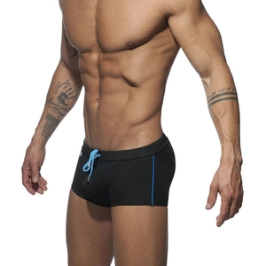 Close-up of men's black swim trunks featuring blue drawstring and side stripe details