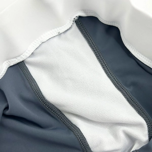Detailed macro view of the breathable white moisture-wicking gusset lining and stitching