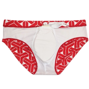 Detailed view of men's geometric swim briefs with front pouch and white mesh lining