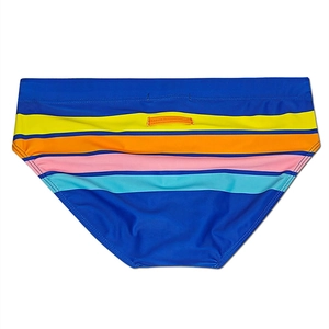 Detail of royal blue swim trunks with vibrant multicolor stripes and elastic waist