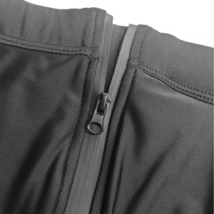 Detail of waterproof front zipper on black high-stretch men's swim briefs