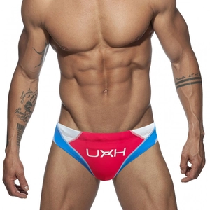 Men's athletic swim briefs in red, white, and blue color-block design with logo