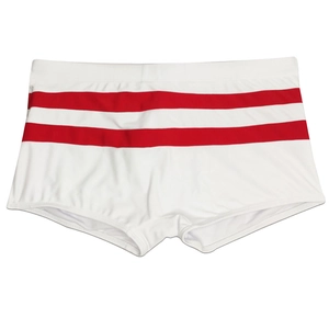 Detail view of white men's swim trunks with dual red stripes and a rear zipper pocket