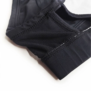Macro shot of breathable black mesh fabric and high-density stitching for men swimwear