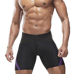 Detail of men's mesh swim shorts featuring purple side stripes and breathable fabric