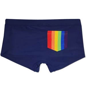Detail view of men's navy blue swim trunks featuring a rainbow striped back pocket design