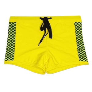Detail of neon yellow men's swimming trunks with black side mesh and metal-tipped drawstring