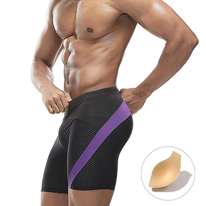 Men's mesh swimming trunks in black with purple side stripes and breathable padded cup