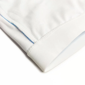 Detail shot of white elastic swimwear fabric with reinforced blue stitching for durability