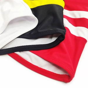Close-up of quick-dry men's swimwear fabric with striped patterns and fine stitching