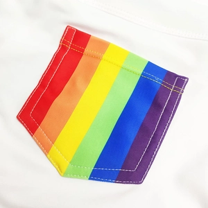 Detailed macro of a white swimsuit featuring a colorful rainbow striped pocket design