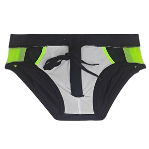 Detail of men's low-rise swim briefs with neon green trim and adjustable drawstring