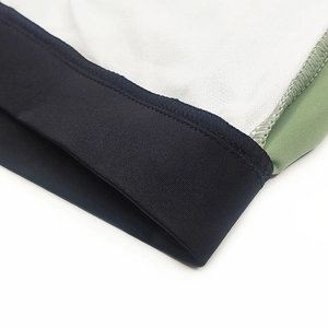 Close-up of tricolor contrast stitching and high-elastic fabric for men's swim trunks