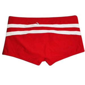 Detailed view of red men's swimming trunks with white stripes and elastic drawstring