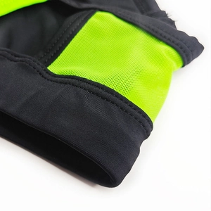 Macro shot of breathable mesh fabric with neon green contrast and reinforced stitching