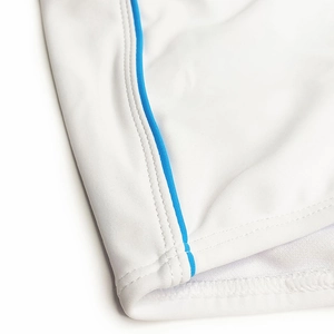 Detailed close-up of white swim trunks featuring blue piping and durable double-stitch seams