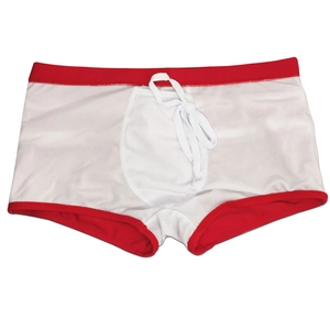 Close-up of white men's swim trunks with red contrast piping and drawstring waist
