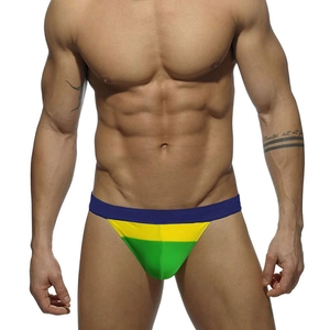 Detailed view of men's quick-dry swim briefs featuring vibrant color-block patchwork design