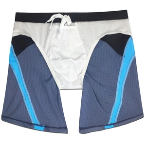 Detail of color-block swim trunks featuring breathable mesh fabric and white drawstring