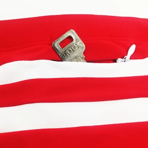Detail of swimwear hidden back zipper pocket with key storage and red striped fabric
