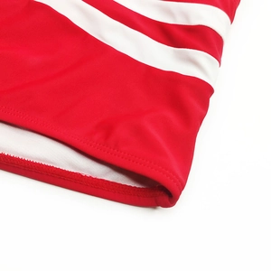 Detail of red and white striped swimwear with durable double-stitched flat hemline