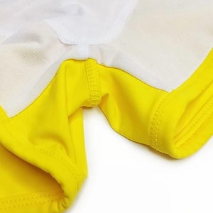 Macro shot of quick-dry swim trunks with breathable white mesh lining and reinforced stitching