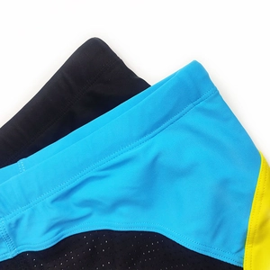Detail of reinforced double stitching and breathable mesh fabric on men's swim trunks