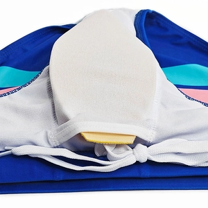 Detail of men's blue swim briefs showing white mesh lining and removable protection pad