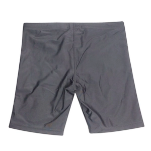 Flat lay detail of dark grey quick-dry men's swim shorts with elastic fabric texture