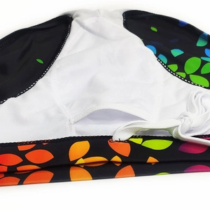 Detail of breathable white mesh lining and gradient leaf print on men's swim briefs