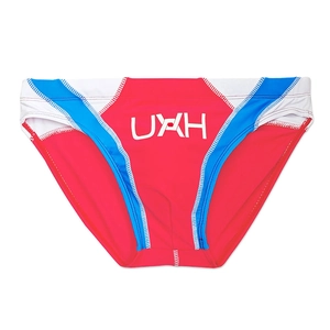 Detail of men's athletic swim briefs with red white blue patchwork and UXH logo