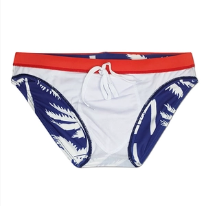 Detail of men's quick-dry swim briefs with palm leaf print and adjustable drawstring waist