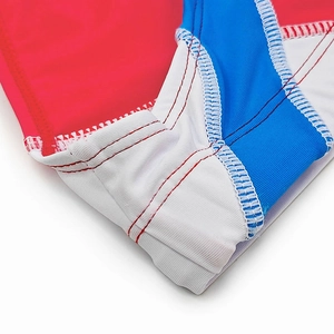 Detailed close-up of flatlock stitching on tricolor patchwork quick-dry swim briefs