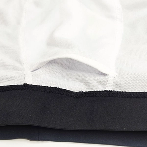 Close-up of men's swimming trunks showing U-convex pouch design and precise stitching detail