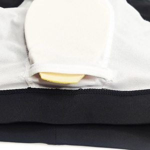 Detail of the white mesh lining and removable padding pocket of men's swim trunks