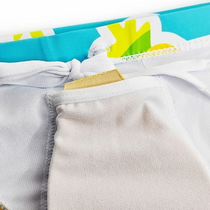 Detail view of quick-dry swim trunks with mesh lining and inner pocket