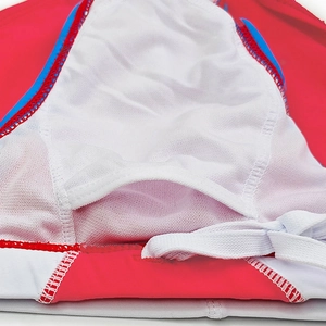 Detailed macro view of men's swim trunks with white mesh lining and padded insert pocket