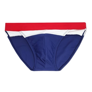 Detail of men's quick-dry swim briefs featuring red, white, and navy tricolor design