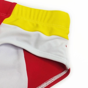 Detail of men's color-block swim briefs with elastic waistband and contrast stitching