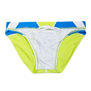 Detailed view of color-block swim briefs with drawstrings and geometric paneling