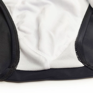 Detailed macro shot of quick-dry swim brief lining with precise stitching and fabric