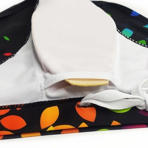 Detail of printed men's swim briefs featuring internal pocket for removable sponge padding