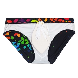 Detail of men's swim briefs with colorful leaf print and functional white drawstring